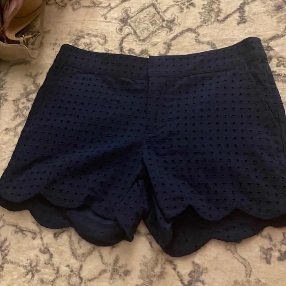 Navy scallop eyelet shorts with slit back pockets and front side pockets